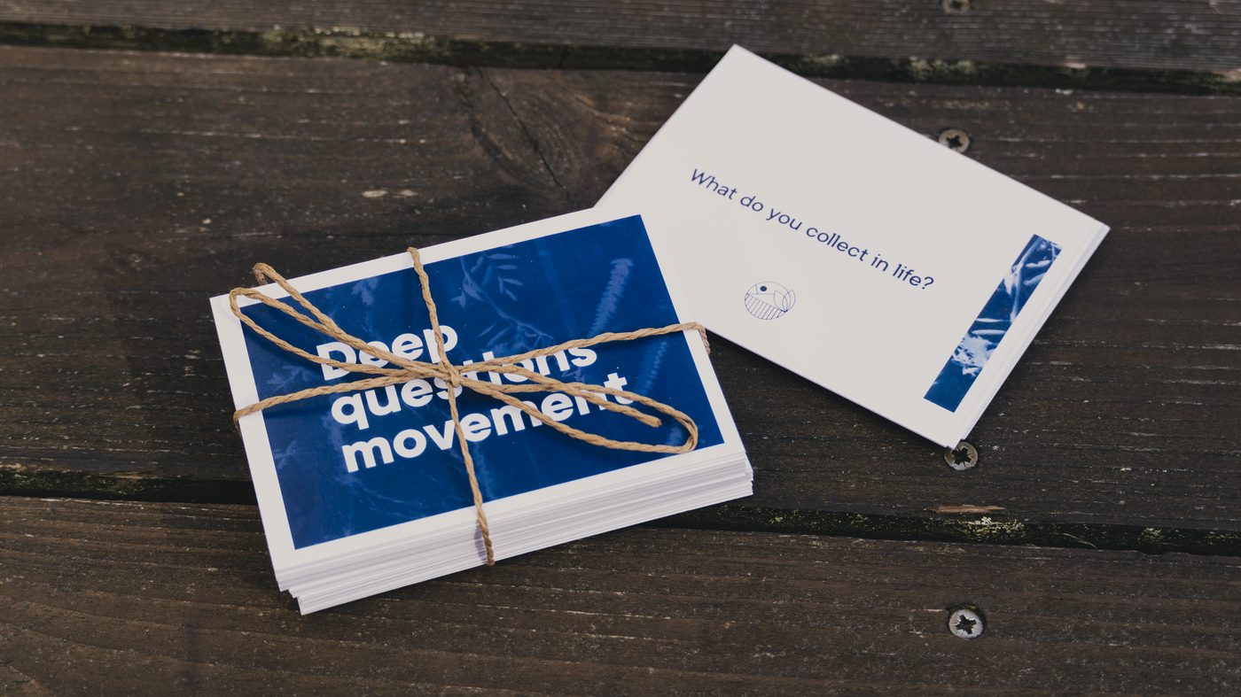 A bundled Deep Questions Movement deck tied with string